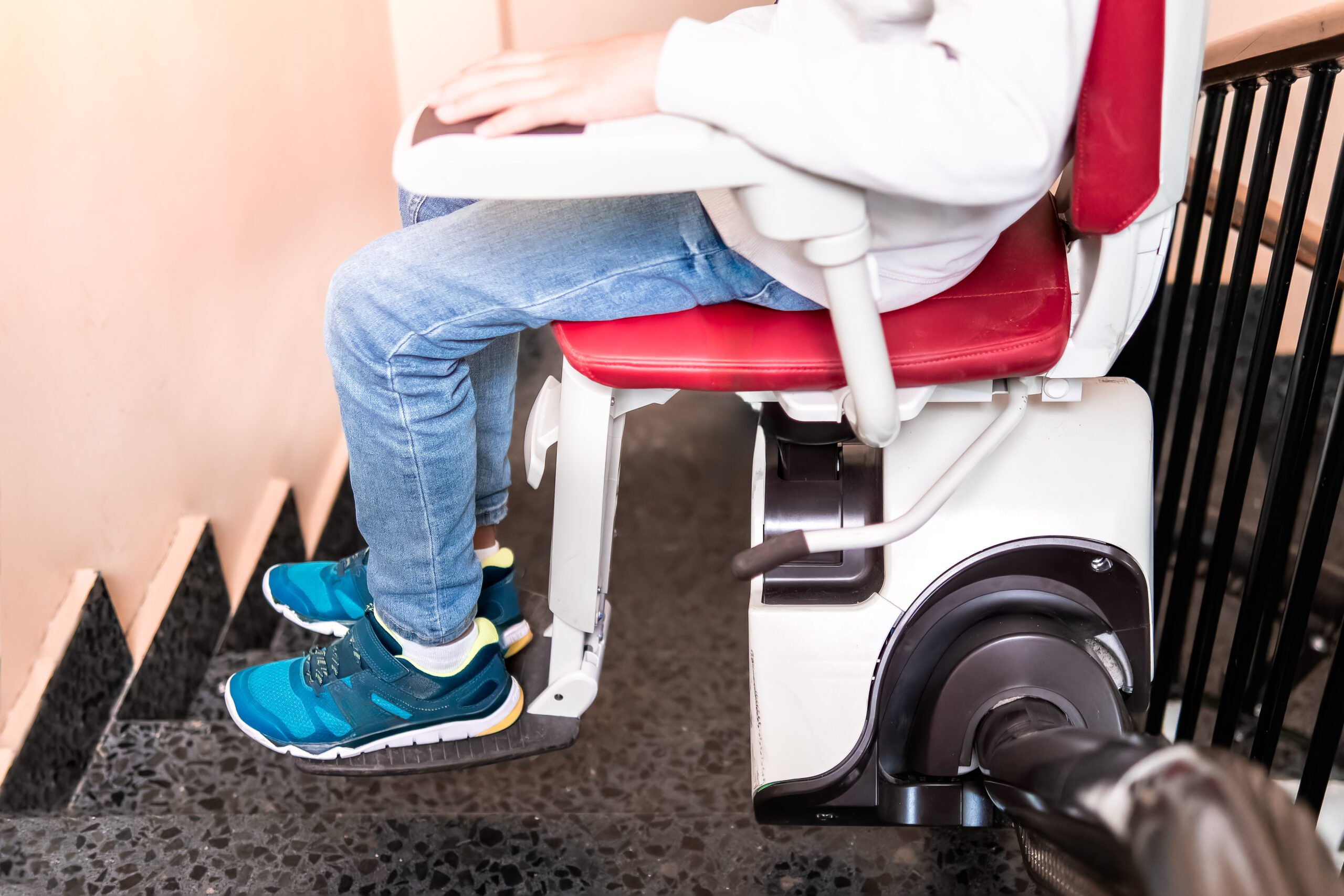 Close-Up of Child’s Legs on Stairlift